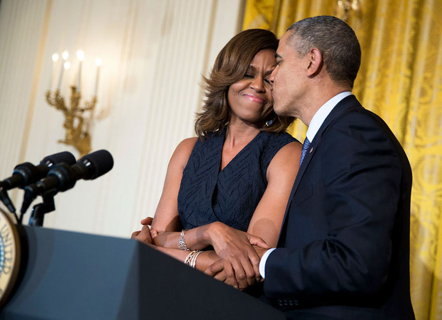 Barack kissing Michelle 
