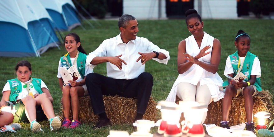 The Obama couple sitting near campfire at the White House Campout