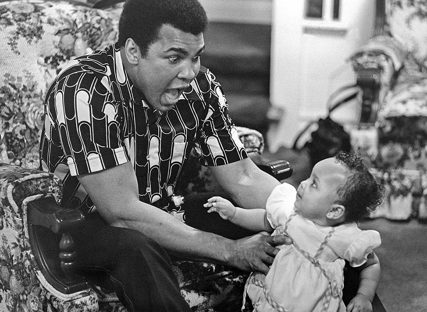Muhammad Ali Is Photographed Taking Time Away From The Ring To Delight In Cuddling And Playing With Daughter, Baby Hana, 1977