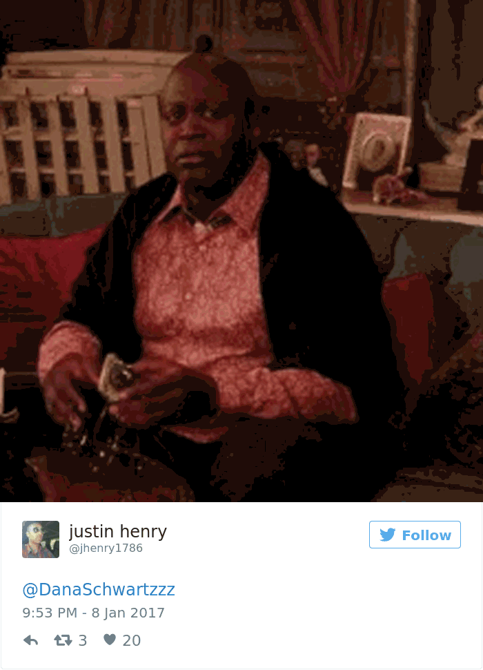 Man holding an owl without fur, seated indoors, sparking online fascination.