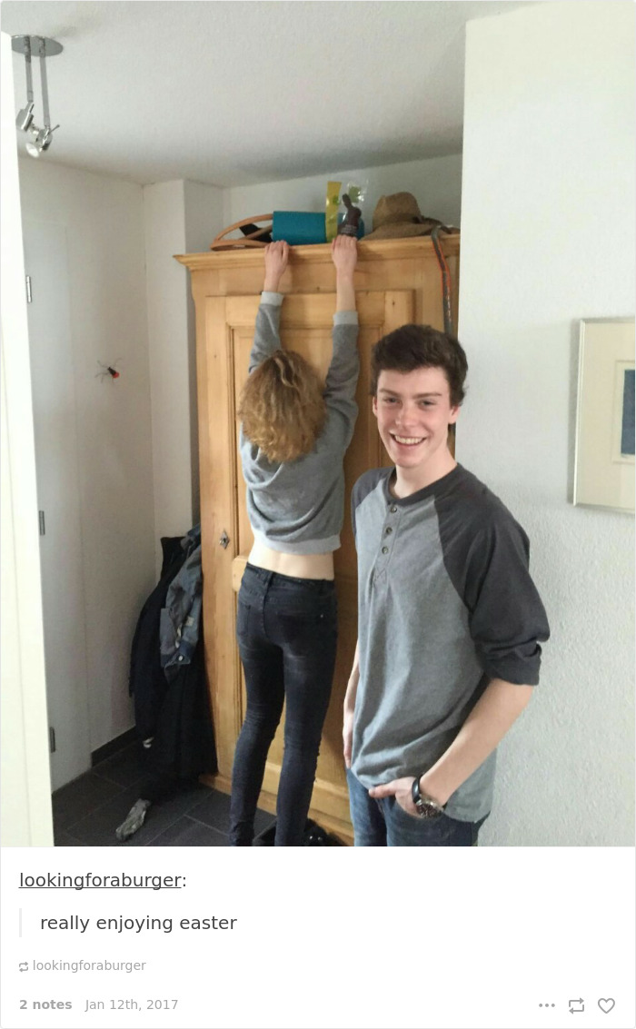 Person reaching top shelf, demonstrating short people problems, while another smiles nearby.