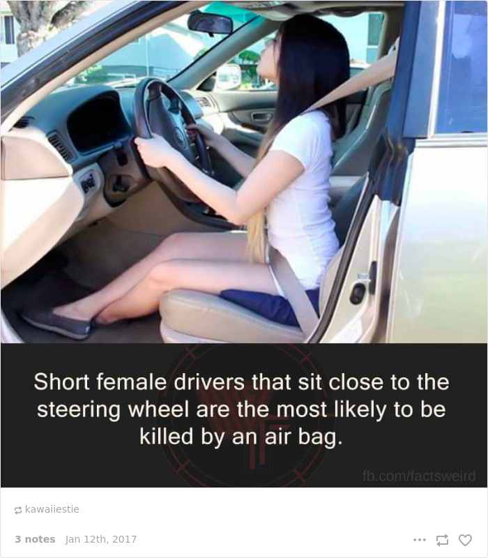 Short person in a car, sitting close to the steering wheel, highlighting a common problem faced by short drivers.