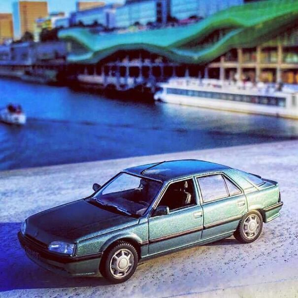 A Night Guard At The Louvre Takes Photos Of His Model Cars Between Shifts