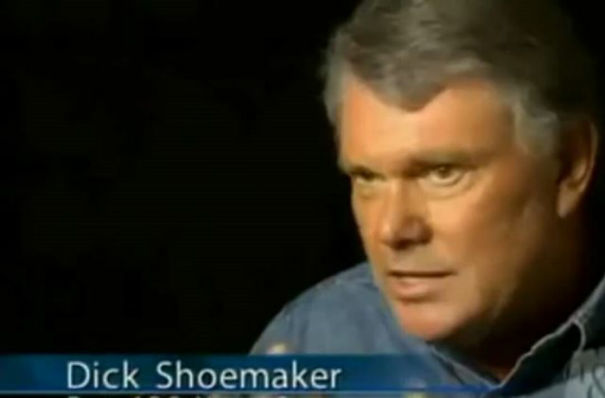 A man named D**k Shoemaker, a humorous name, in an interview setting with a serious expression.