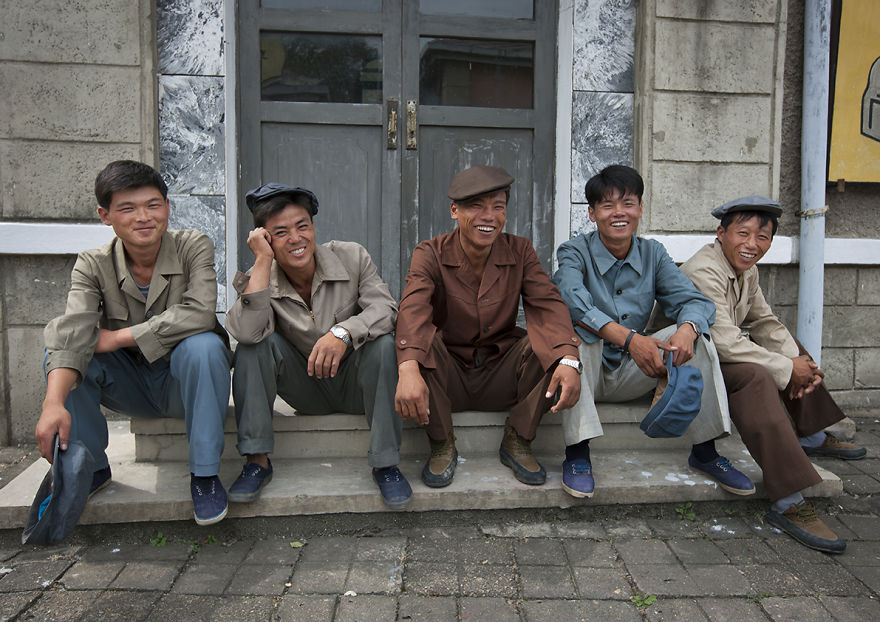 Actors Sitting On Steps And Smiling At Pyongyang Film Studio, North Korea