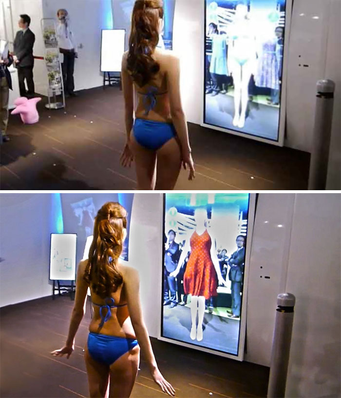woman standing near an interactive virtual mirror
