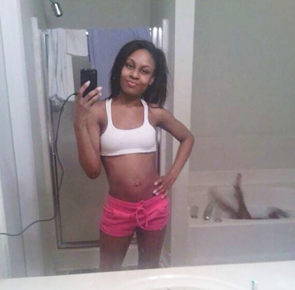 Woman taking mirror selfie 