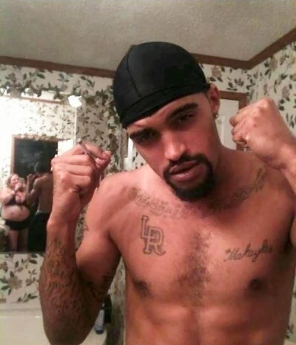 Woman taking a photo of a man 