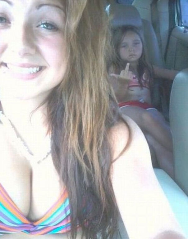 Woman taking selfie with her daughter
