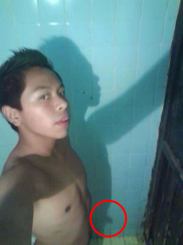 Man taking selfie in the bedroom 