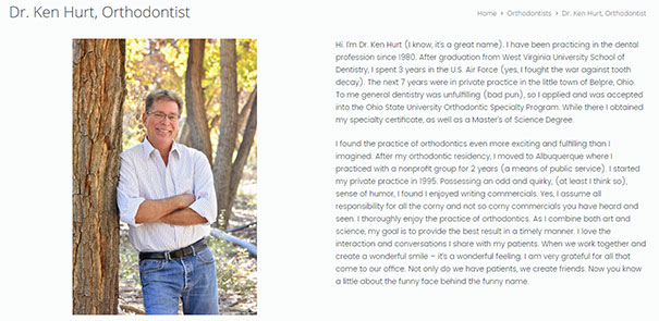 Dr. Ken Hurt, an orthodontist, stands casually by a tree, smiling in a relaxed, outdoor setting.