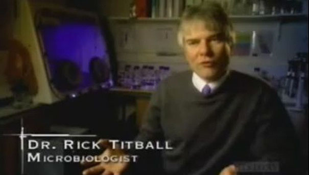 Microbiologist in a lab setting discussing findings with a serious expression, connected to a list of funny names.