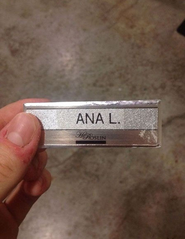 Close-up of a humorous name badge reading "ANA L."