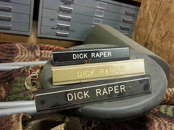 Three nameplates with a funny name displayed in an office setting.