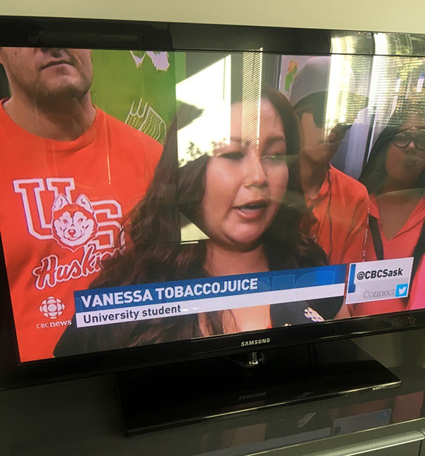 TV screen shows a university student named Vanessa Tobaccojuice in a news segment, wearing an orange shirt.