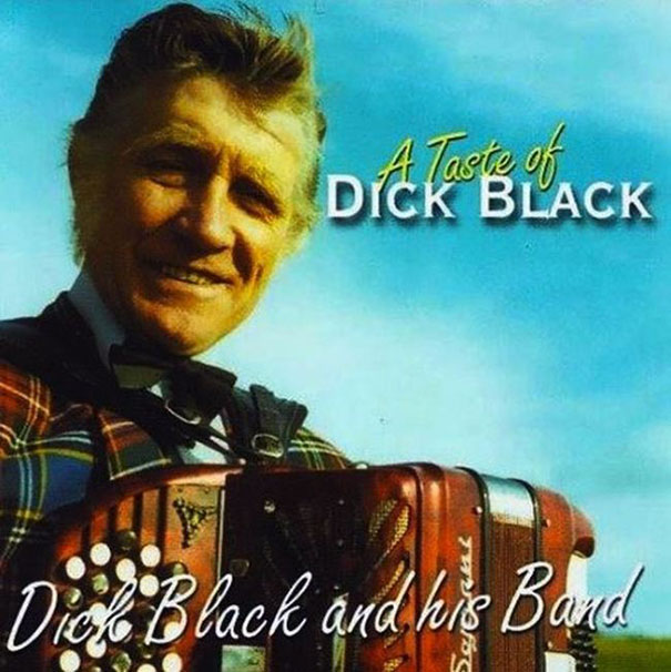 Man in plaid suit holding an accordion with "A Taste of D**k Black" text, illustrating funny names.