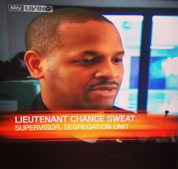 Man named Chance Sweat on TV as supervisor, highlighting funny names.