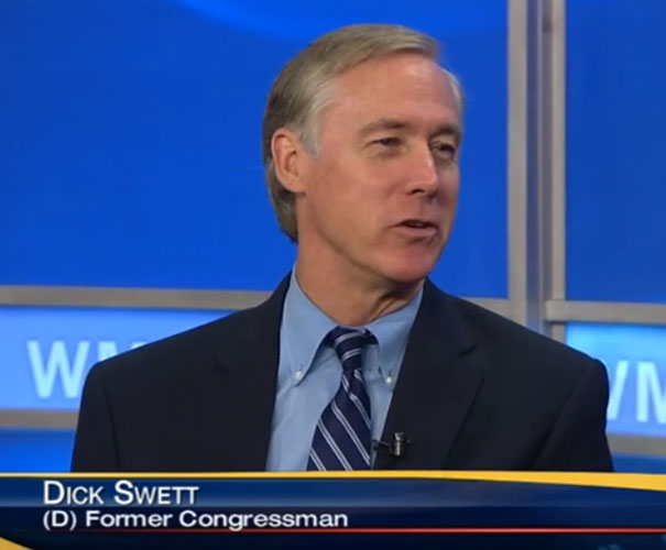 Former congressman in a suit speaks on a news program, illustrating funny names.