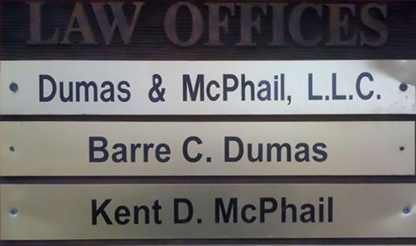 Law office sign with funny names: Dumas & McPhail, Barre C. Dumas, Kent D. McPhail.