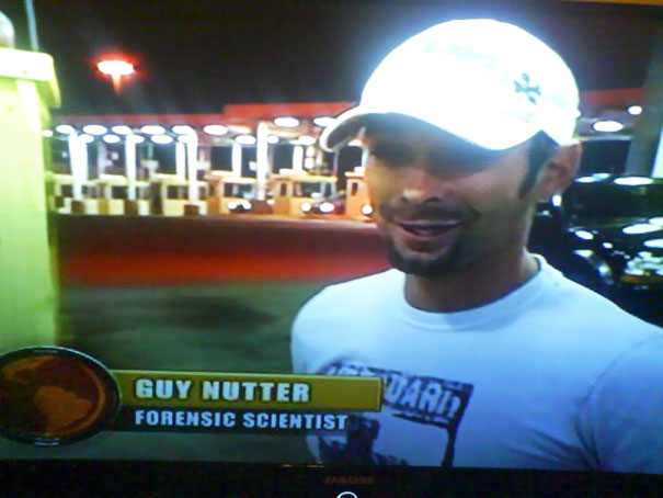 Man in a white cap and t-shirt labeled as a forensic scientist, featuring a funny name.