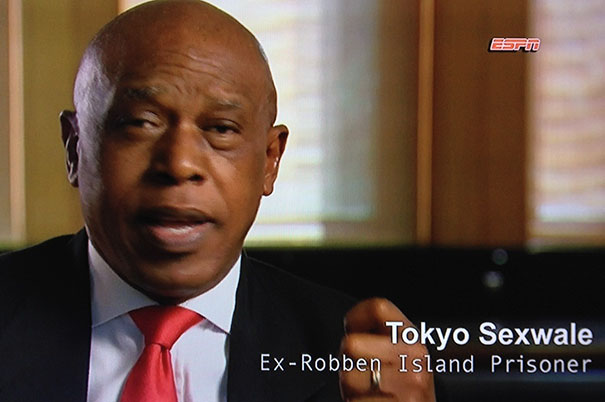 A person in a suit speaking on ESPN with text overlay of a funny name.