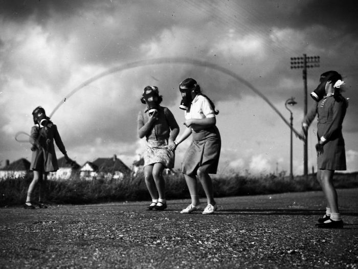 London Children Wear Their Gas Masks As They Skip In The Park At Their Temporary Homes On The South Coast Of England, 1940