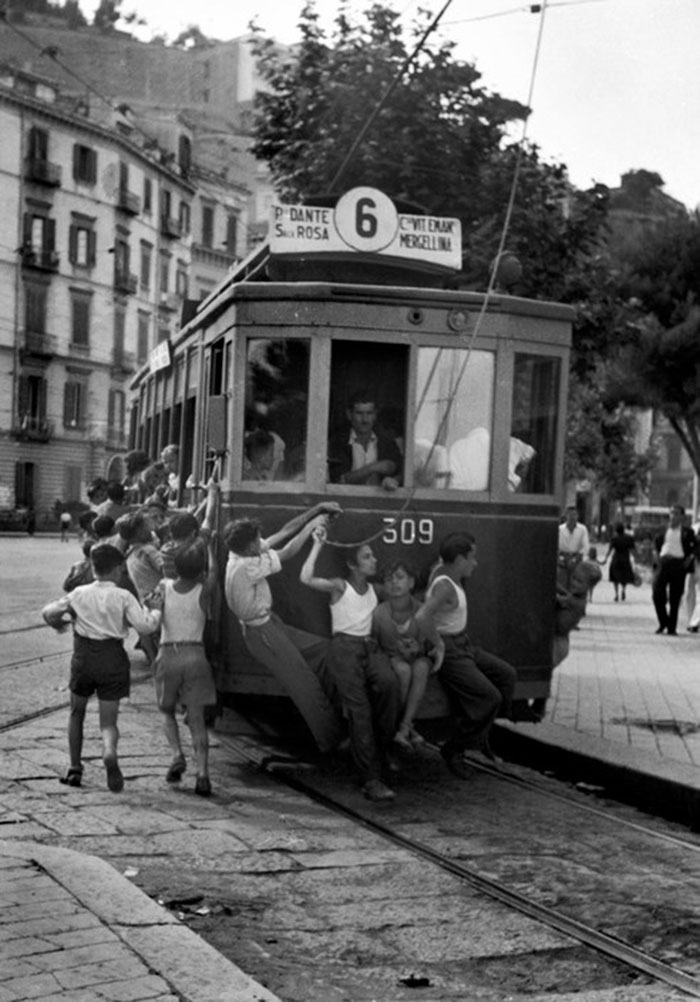 These Young Neapolitans Like The Danger Of The Strictly-forbidden Practise Of Hanging Onto The Backs Of Street Cars, 1948