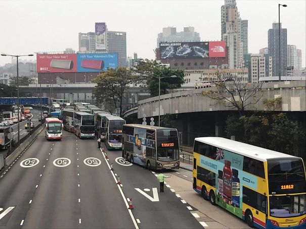Bus Driver Near Busy Stop Ticketed For Letting Passengers Get Off Early Due To Congestion. Reaction: Today Bus Drivers Coordinated To Do Things By The Book And Only Stop Exactly At Bus Stops; Huge Line-Up Ensues