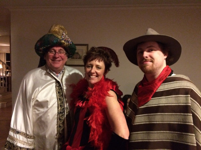 Dads in costumes with friends, showcasing next-level humor in a playful setting.