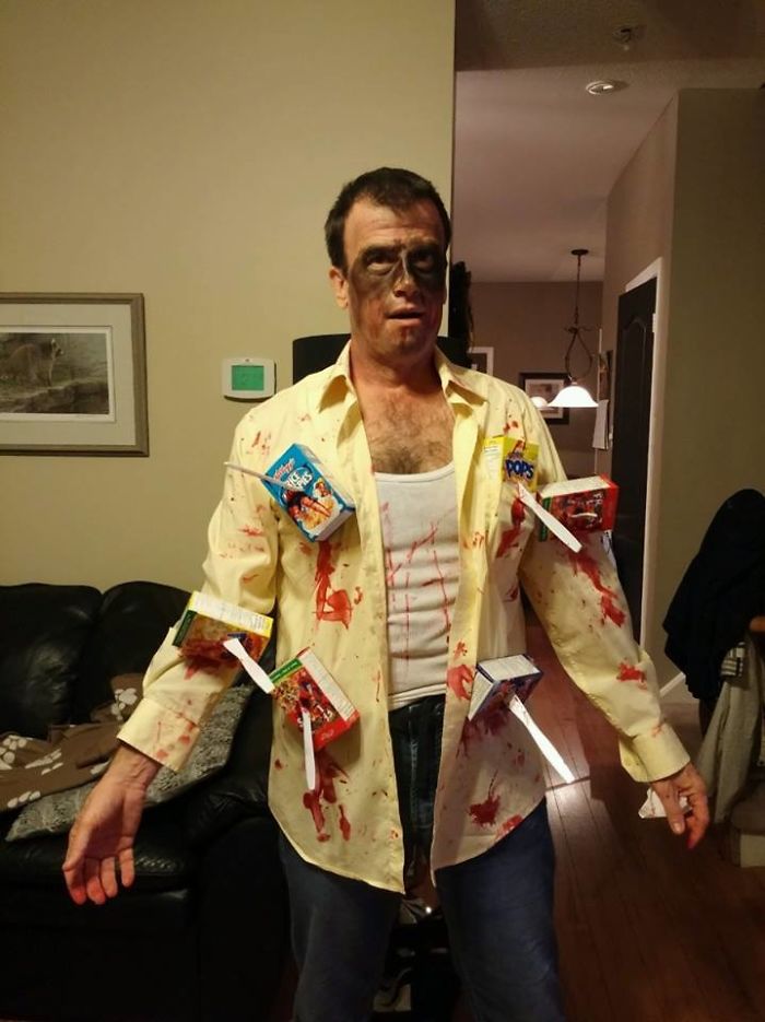 Dad dressed humorously, with cereal boxes attached, showcasing dad jokes taken to another level.
