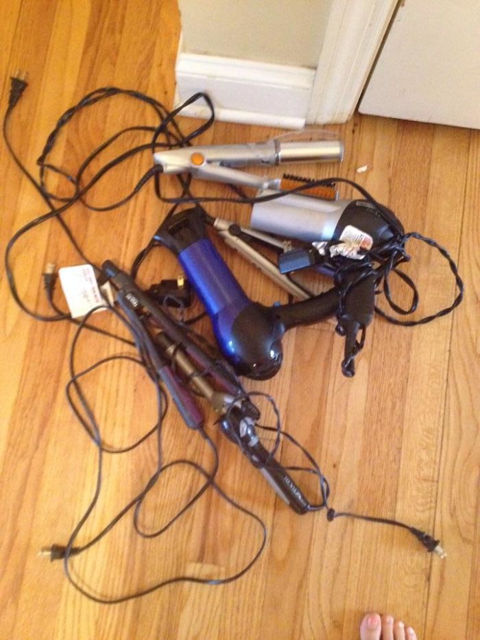 Dad humor with tangled hair tools on wooden floor, showcasing creative jokes.