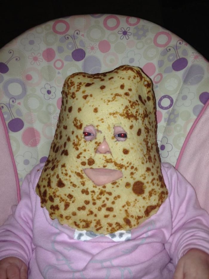 Baby with pancake mask, illustrating creative dad jokes taken to another level.