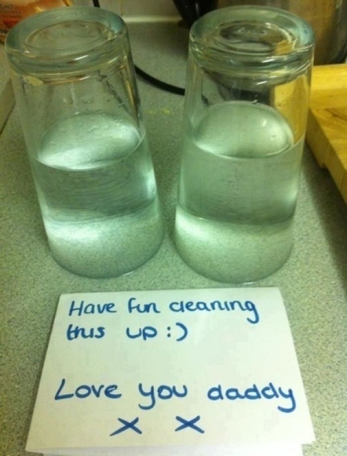 Dad joke with two upside-down water glasses and a playful note on a counter.