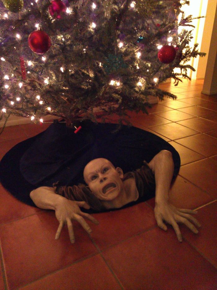 Dad joke taken to another level with a creepy mannequin under the Christmas tree.