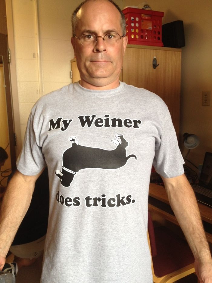 Dad wearing a gray T-shirt with a humorous dachshund graphic and text: "My Weiner does tricks."