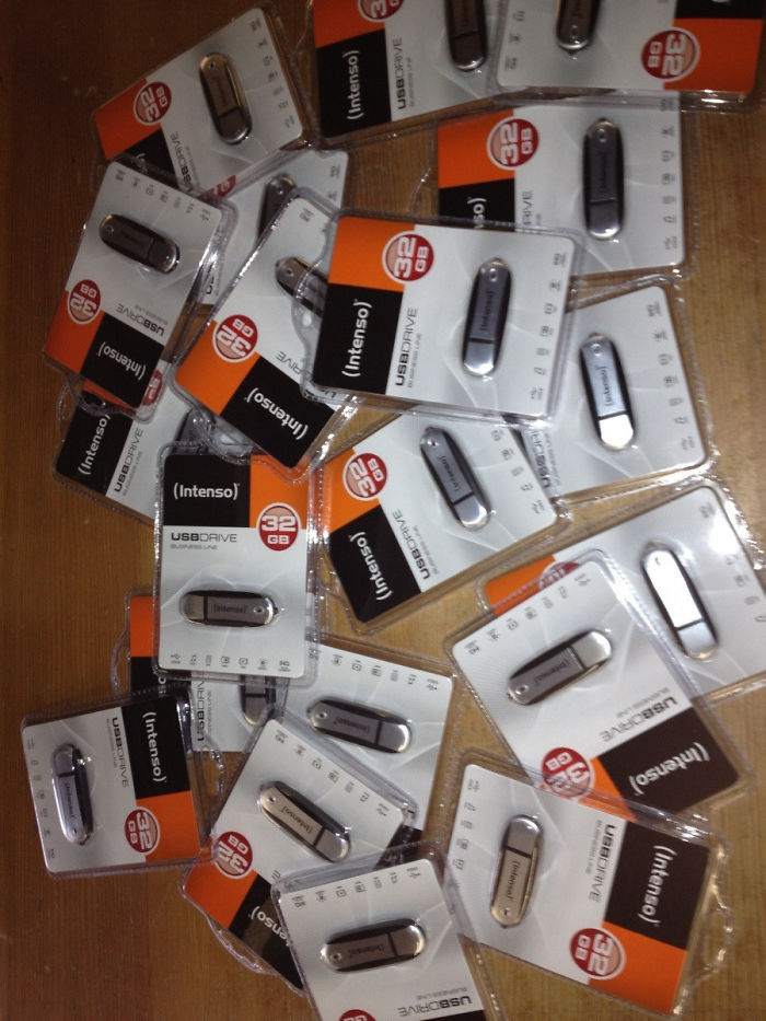 A pile of USB drives humorously packaged as if collectible cards, showcasing a dad's joke elevated to another level.