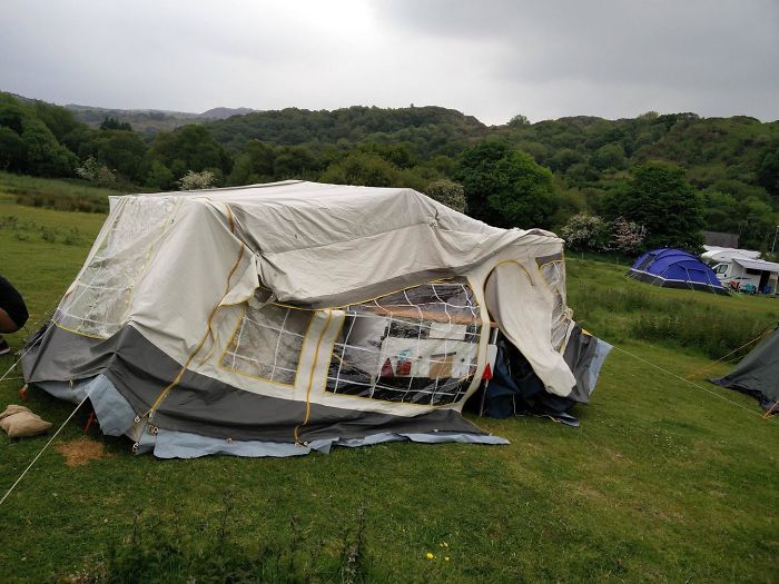 Dad's tent humor gone too far, resulting in a collapsed tent at a scenic campsite.