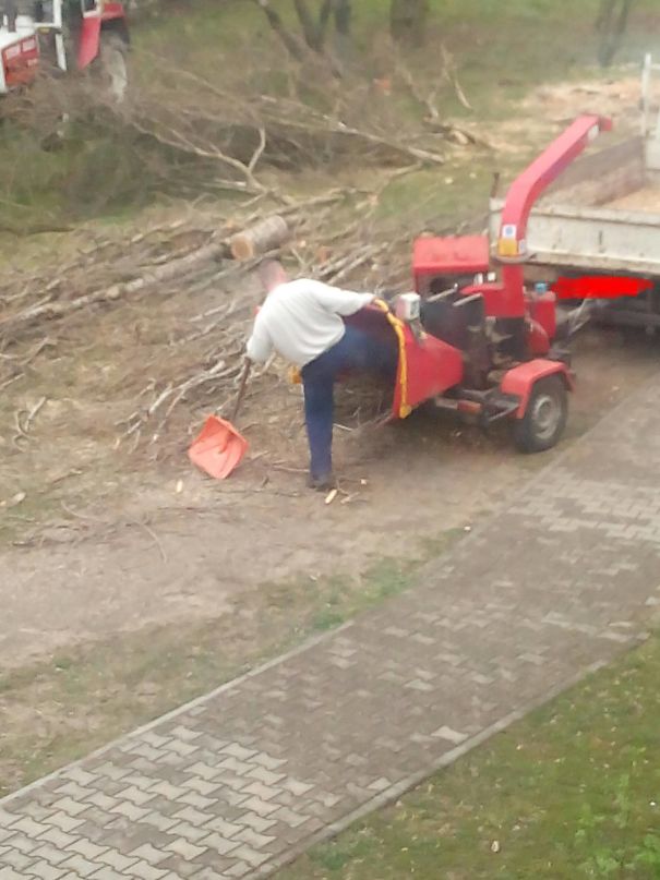 Man engaging in risky behavior with wood chipper, illustrating why women live longer than men.
