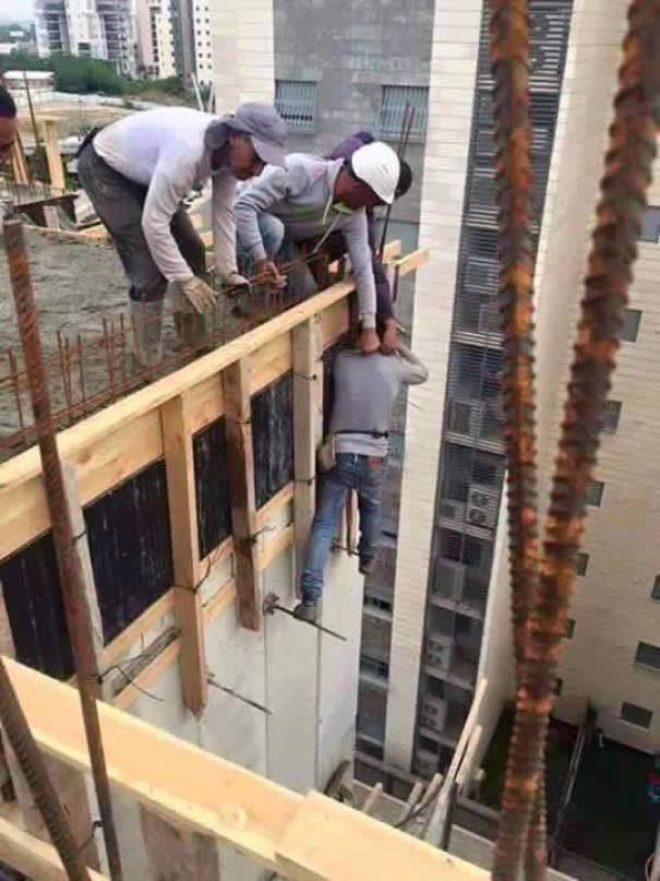 Construction workers on a high-rise building using risky techniques; capturing why women live longer than men.