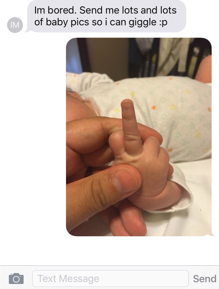Text message joke with a baby hand humorously staged by dad.