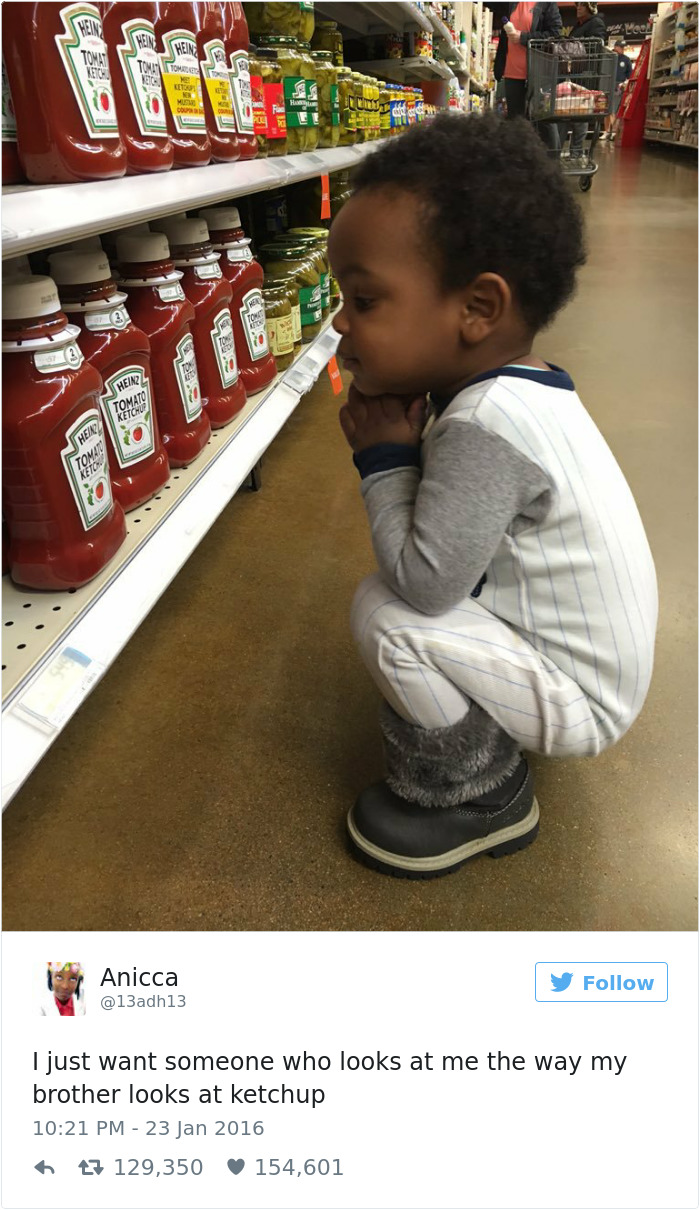 Child crouched in a store aisle, fascinated by ketchup bottles, capturing a funny aspect of dating.