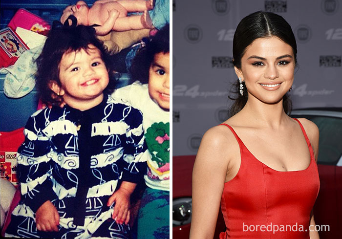 Rare celebrity childhood photo of a smiling toddler next to an adult woman in a red dress at a formal event.