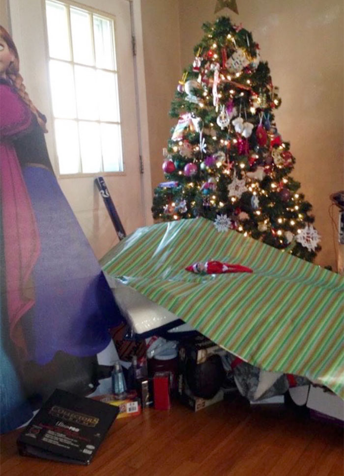 Dad joke: Christmas gift over-wrapped under the tree with humor, showcasing playful creativity.