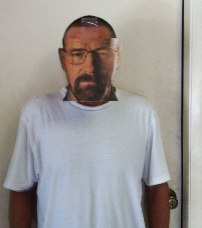 A dad wearing a printed mask over his face, showcasing dad jokes taken to another level.