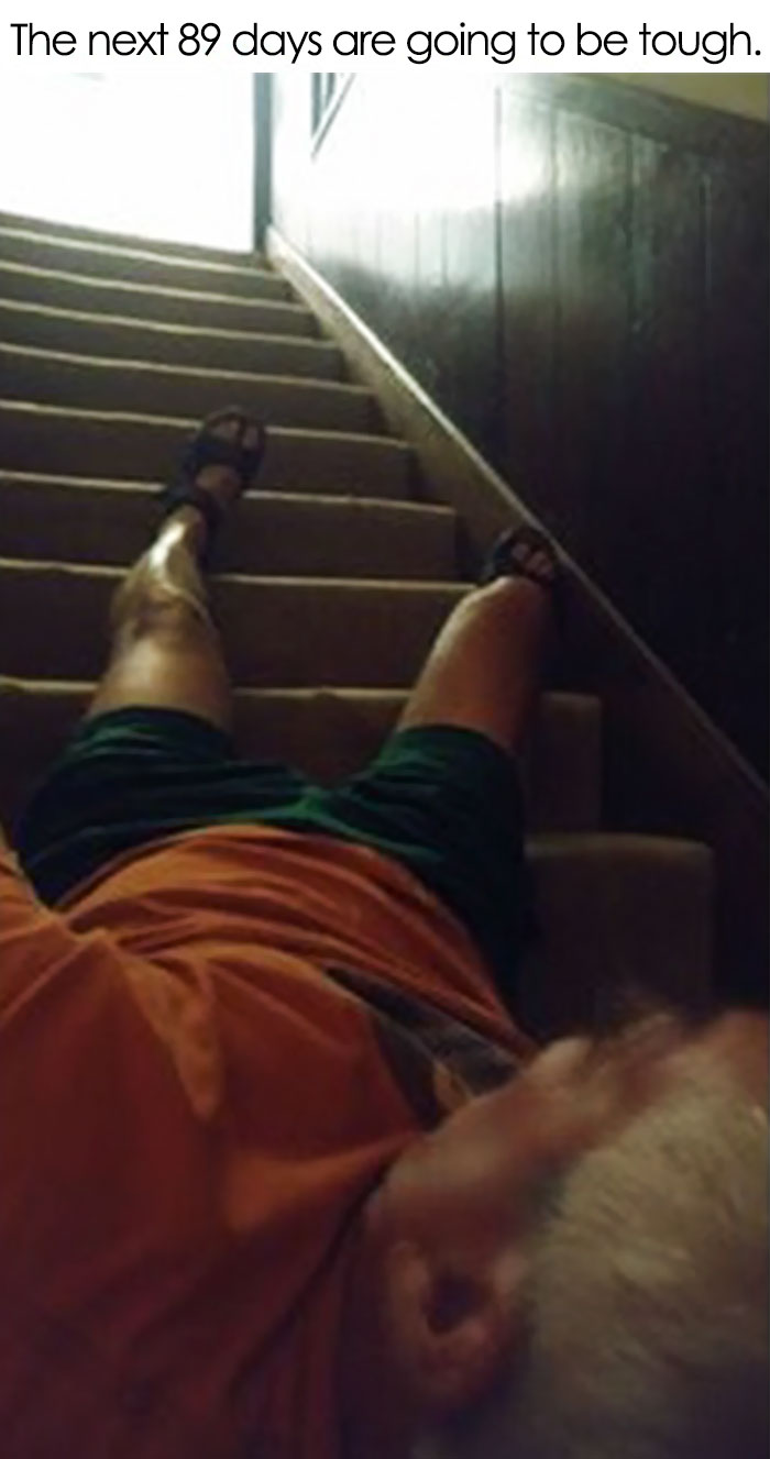 Man humorously lying on stairs, showcasing dads taking jokes to another level.