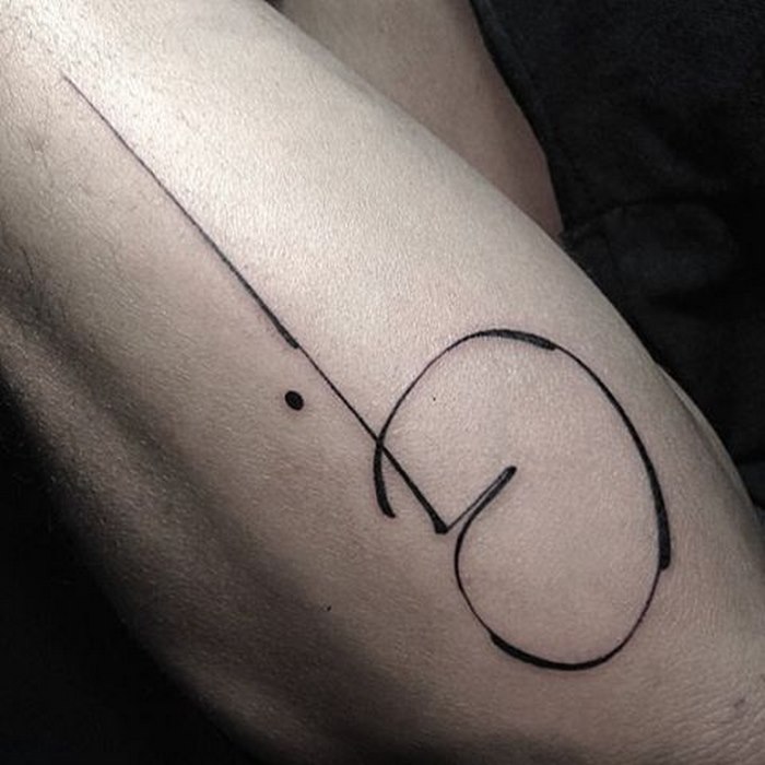 Delicate typographic tattoo on arm by Léo Gavaggio, showcasing sophisticated design.