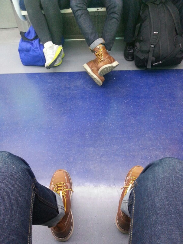 Mans sitting and wearing same shoes and jeans