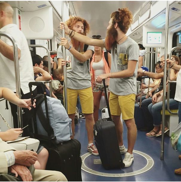 Two mans looking at each other and wearing same clothes