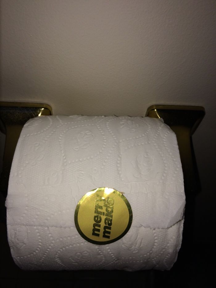 Toilet paper roll with a gold sticker, showcasing an amusing oversight typical for dating an idiot.