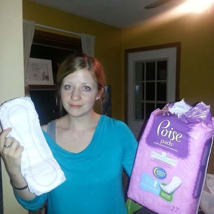 Woman holding Poise pads in a humorous situation, highlighting quirky dating moments.